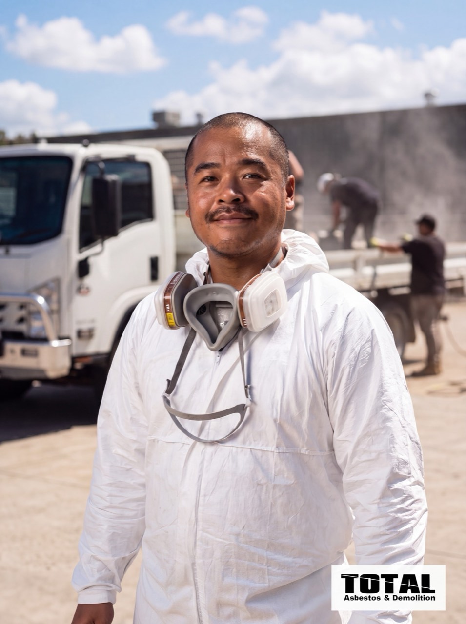 Somah, TARB's owner-operator, in full PPE with the crew truck behind him